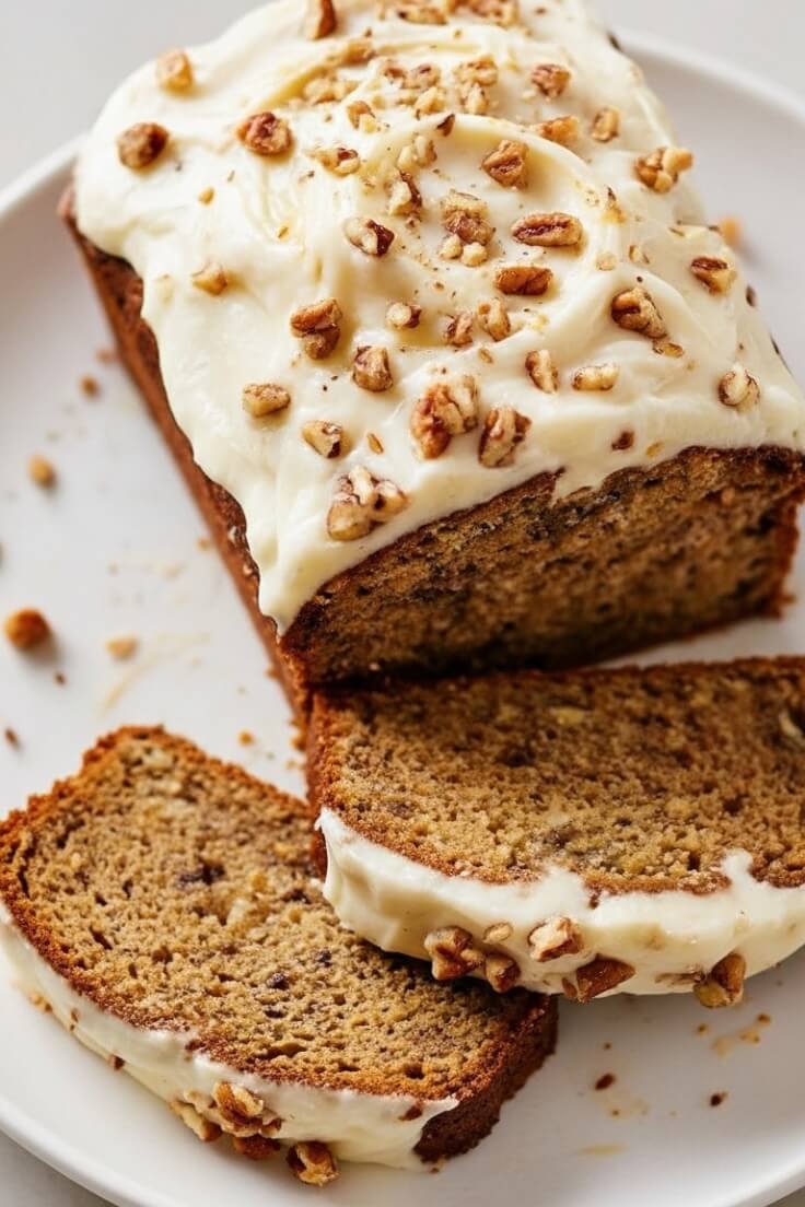Moist and rich Banana Pecan Bread with a creamy cream cheese layer. Sweet bananas, crunchy pecans, and soft crumb make this loaf irresistible.