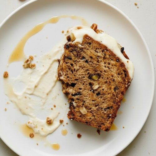 Moist and rich Banana Pecan Bread with a creamy cream cheese layer. Sweet bananas, crunchy pecans, and soft crumb make this loaf irresistible.