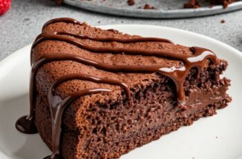 This flourless chocolate cake is decadently rich and fudgy, naturally gluten‑free, and topped with a glossy ganache—simply amazing for any chocolate lover.