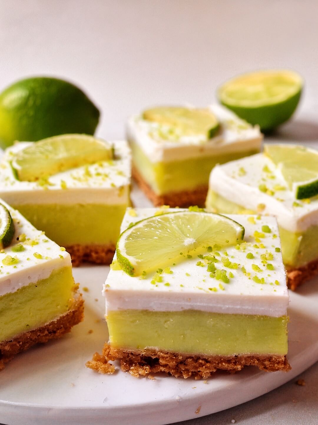Key Lime Pie Bars are a tangy, creamy dessert with a buttery crust, a smooth lime filling, and a layer of fluffy whipped topping.