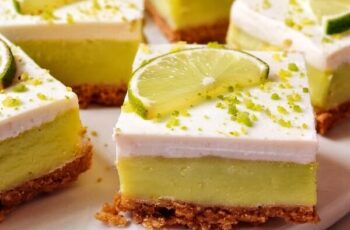 Key Lime Pie Bars are a tangy, creamy dessert with a buttery crust, a smooth lime filling, and a layer of fluffy whipped topping.