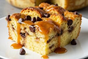 Chocolate Chip Bread Pudding is warm, rich, and comforting—soft custard-soaked bread studded with melty chocolate chips and baked to golden perfection!