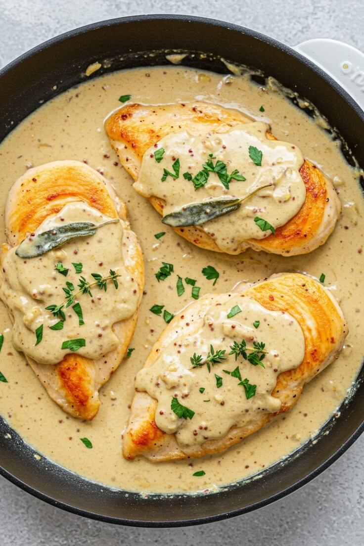 Creamy Dijon Mustard Chicken is a savory and velvety dish with tender chicken breasts, tangy mustard, fragrant herbs, and a touch of honey for perfect balance.