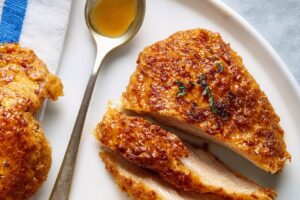 Crunchy Hot Honey Chicken is coated in crispy cornflakes and drizzled with spicy-sweet honey for the ultimate bold, juicy, flavor-packed bite