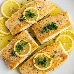 Lemon Butter Cod is flaky, tender, and bathed in a zesty, garlicky butter sauce with fresh herbs and a hint of spice—a quick yet elegant weeknight dinner!