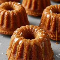 Mini Caramel Cakes are rich, buttery little treats topped with gooey caramel and a touch of flaky sea salt. The perfect balance of sweet and salty in every bite!