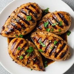 Balsamic Chicken marinated in tangy vinegar, garlic, herbs, and Dijon for a juicy, savory dish that’s full of flavor and perfect for any dinner table!