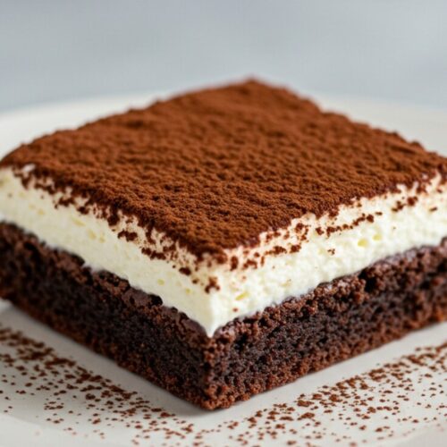Tiramisu Brownie is the ultimate dessert mashup—rich, fudgy brownies layered with creamy mascarpone filling and a bold espresso kick. It combines the indulgence of classic brownies with the elegance of traditional tiramisu for a treat that’s decadent, flavorful, and unforgettable.