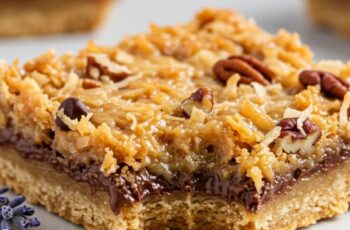 Hello Dolly Bars bring together a buttery graham cracker crust, gooey condensed milk, chocolate, coconut, and pecans for an irresistible, layered treat!